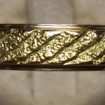 Anello con elementi in oro bicolore con fusione all'osso di seppia
